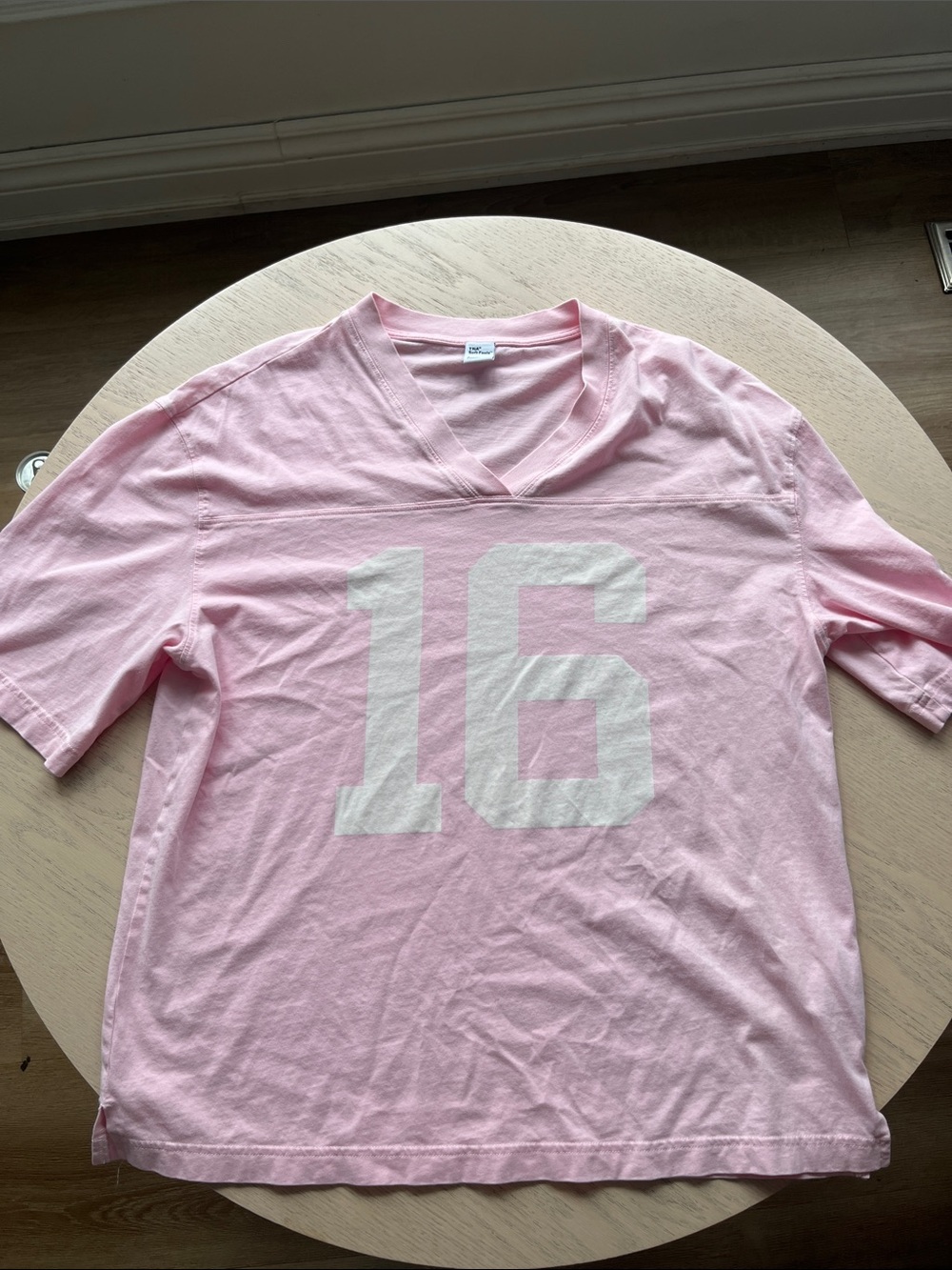 TNA Light Pink V-Neck with White '16' Graphic